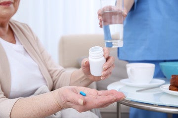 patient taking a pill